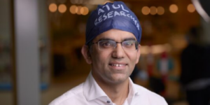 Associate Professor Atul Malhotra smiling toward camera