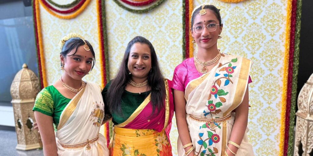 Three Diwali dancers smiling