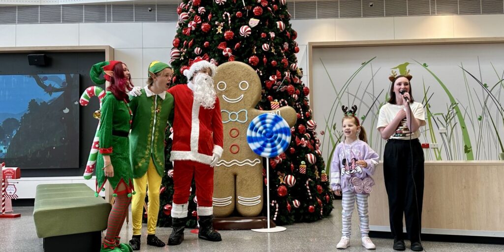 Santa with patients at MCH Christmas tree event