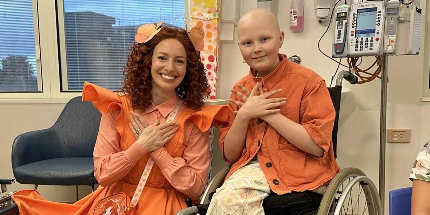 Emma Memma with a young patient in a wheelchair