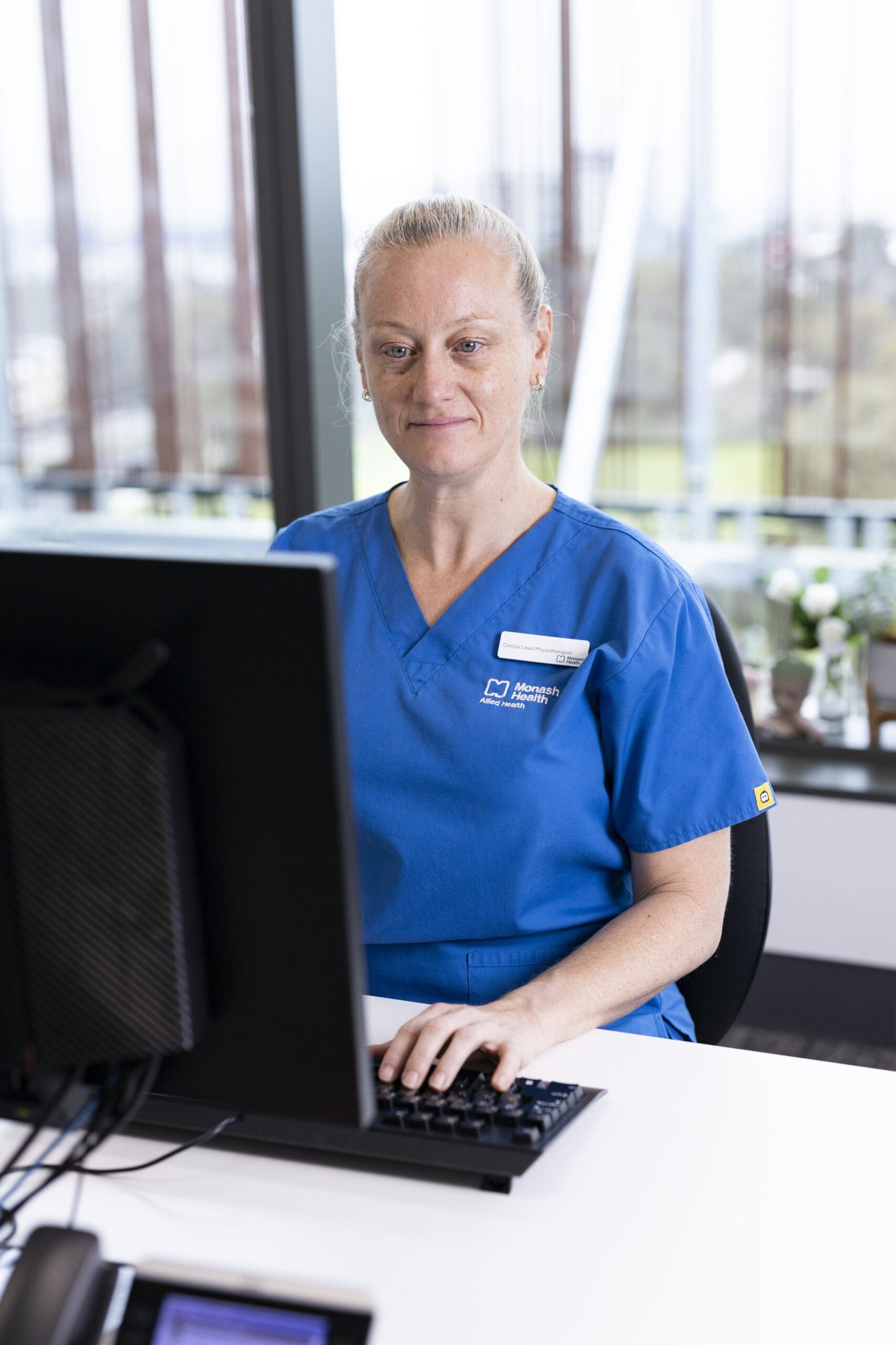 Michelle Paton, Advanced Cardiac and Critical Care Physiotherapist, at her computer