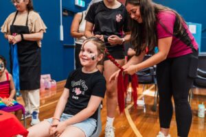 Families enjoyed the fun and games on offer at The Biggest Playdate, such as hair-braiding, face painting, and carnival rides.