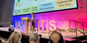 Dr Chunni Lu presenting on stage.